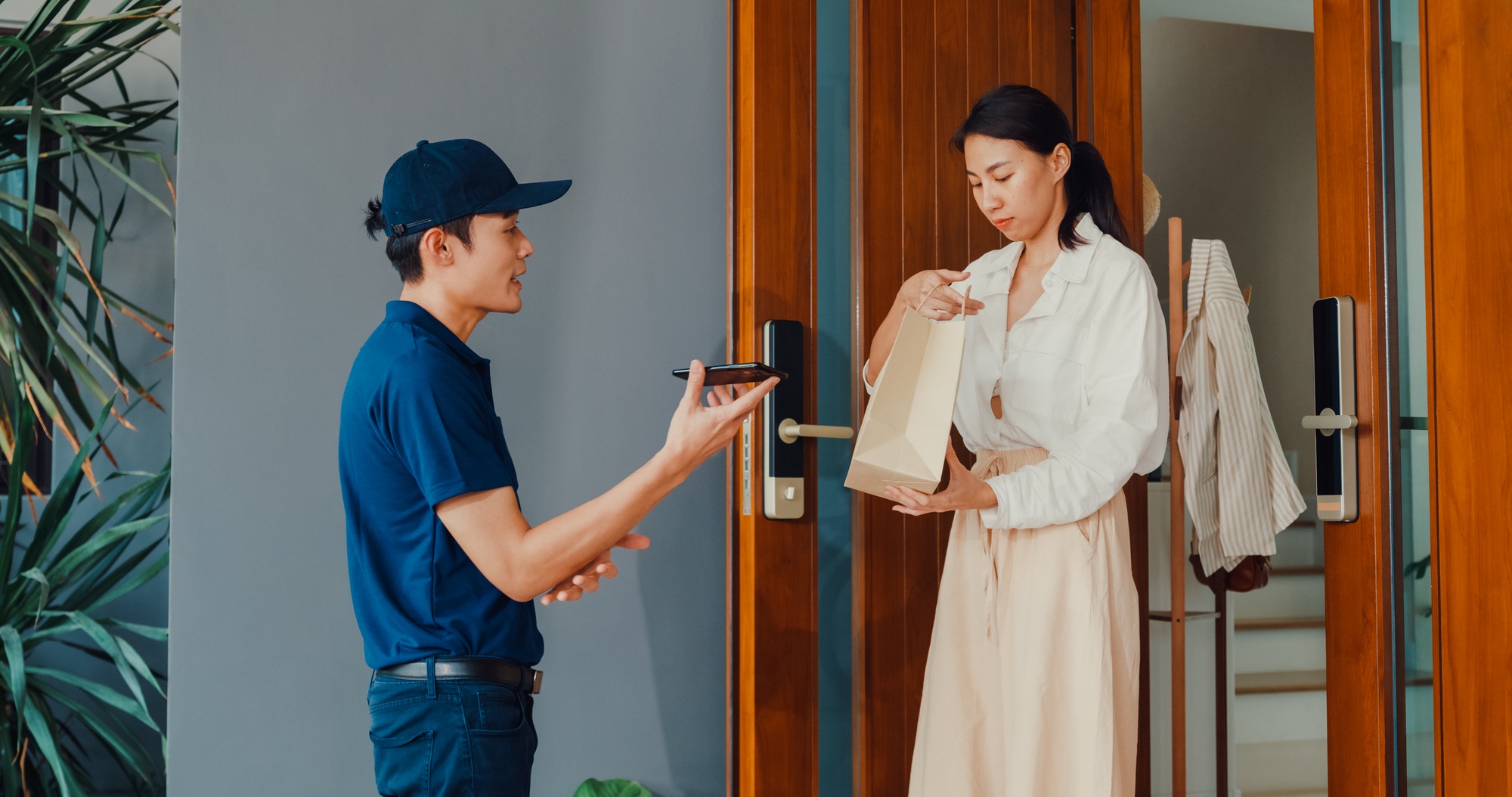 Delivery man knock door home delivery grocery online shopping to woman customer.